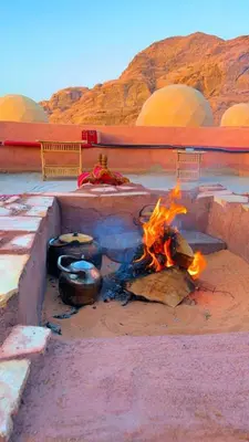 a fire pit in the middle of a desert at Panorama bubble camp in Disah