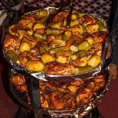a group of trays of food on a table at Wadi Rum Gulf camp in Aqaba
