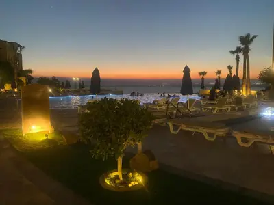 a view of a resort with a pool and a beach at Dead Sea view Elite apartment Samara Resort traveler award 2024 in Sowayma